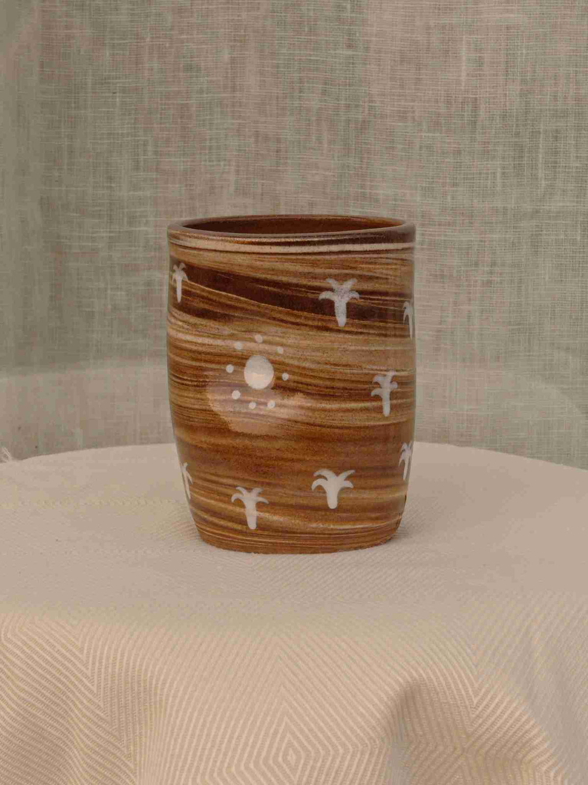 Wheel-thrown two-tone swirl ceramic tumbler with thumb rest