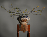 Tall coil-built stoneware vase decorated with sketches and Icelandic black sand