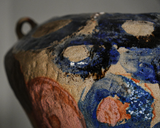 Tall coil-built stoneware vase decorated with sketches and Icelandic black sand