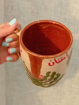 Wheel-thrown Nakhla ceramic mug with khaleeji design