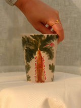 Wheel-thrown ceramic mug with wavy handle and Arabic calligraphy