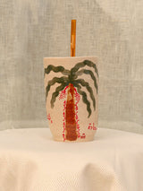 Wheel-thrown ceramic tumbler with palm trees and Arabic calligraphy
