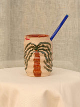 Wheel-thrown swirl ceramic tumbler with palm trees and Arabic calligraphy