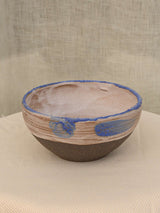 Set of two black clay bowls with textured crawling glaze