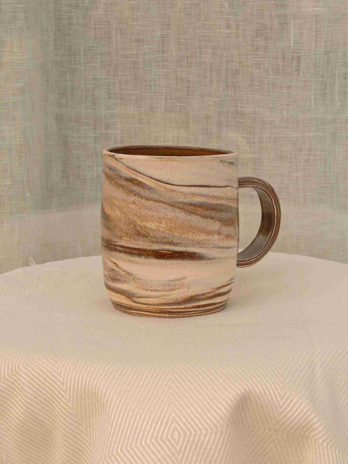 Wheel-thrown cream and brown swirl ceramic mug