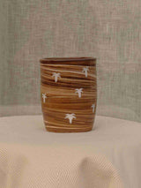 Wheel-thrown two-tone swirl ceramic tumbler with thumb rest