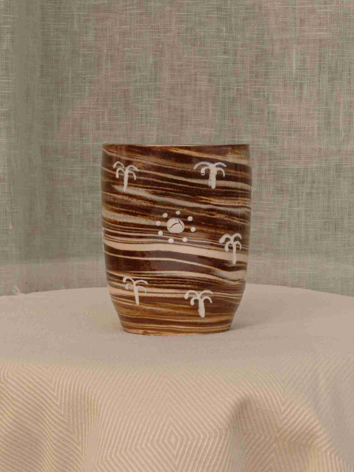 Wheel-thrown two-tone swirl ceramic tumbler with thumb rest