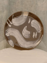 Set of two black clay plates with white slip brush strokes