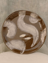 Set of two black clay plates with white slip brush strokes