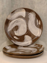 Set of two black clay plates with white slip brush strokes