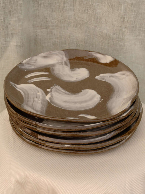 Set of two black clay plates with white slip brush strokes